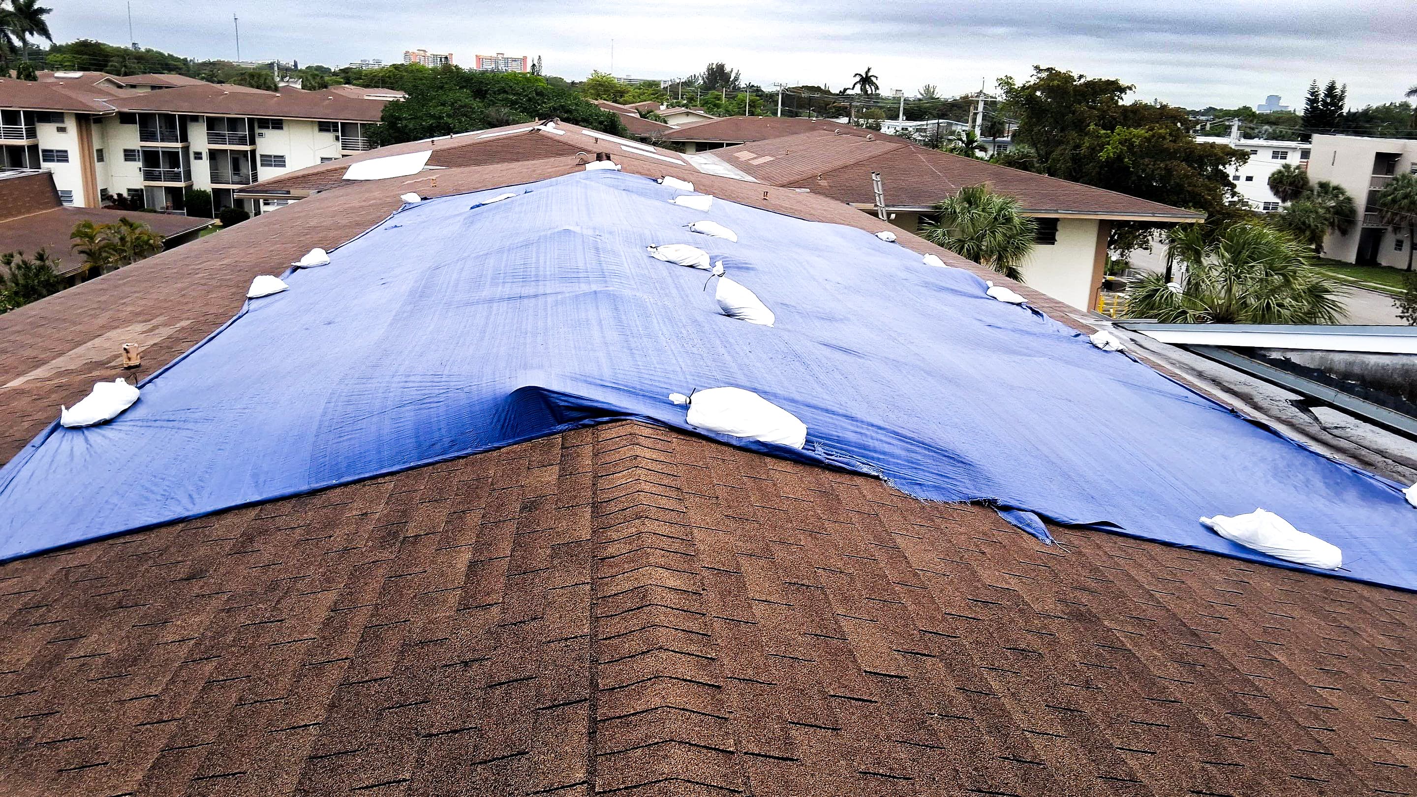 Emergency roof tarping after hurricane damage in Miami — storm response by T&S Roofing Systems