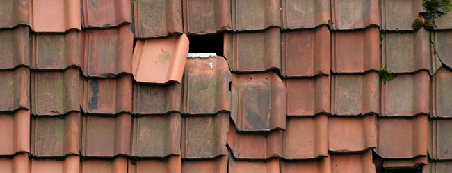 Roof with broken tiles